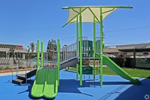 green playground with slides